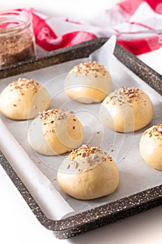 Food concept Proving, Proofing yeast dough of hamburger buns in bake pan before baking