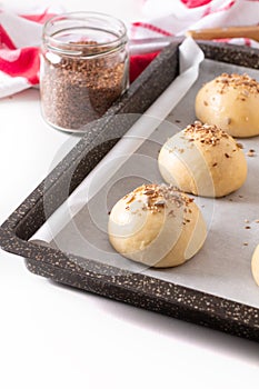 Food concept Proving, Proofing yeast dough of hamburger buns in bake pan before baking