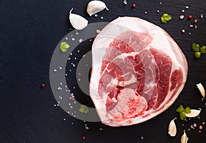 Food concept Raw Pork Leg Chops on black slate board with copy space