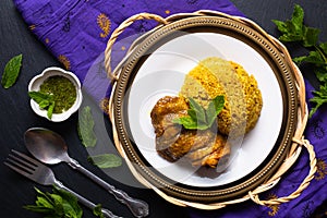 Food concept Thai style homemade Rice and Chicken Biryani Khao Mok Kai on black background with copy space