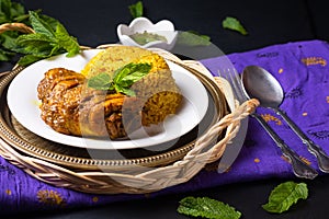 Food concept Thai style homemade Rice and Chicken Biryani Khao Mok Kai on black background with copy space
