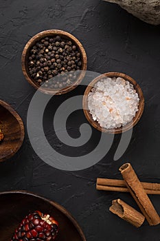 Food concept with wooden presentation board on black stone floor