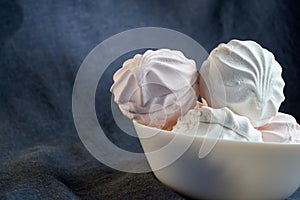 food, confection and sweets concept - close up of zephyr or marshmallow dessert on plate