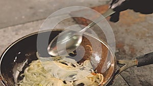 Food cook chef stir sliced onions pan ingredient