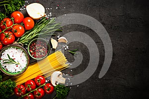 Food cooking background on black kitchen table.