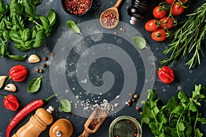 Food cooking background. Fresh rosemary, cilantro, basil, cherry tomatoes, peppers and olive oil, spices herbs and vegetables at