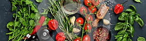 Food cooking background. Fresh rosemary, cilantro, basil, cherry tomatoes, peppers and olive oil, spices herbs and vegetables at