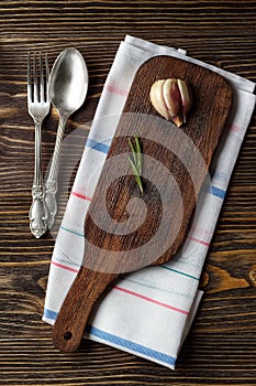 Food cooking background with wooden cutting board, cutlery and spices