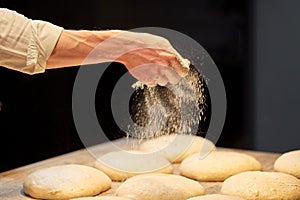 Chef or baker making bread dough at bakery