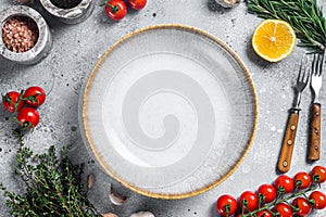 Food cooking and healthy eating background with empty rustic plate and fresh seasoning, knife, fork and vegetables