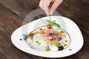 Food decoration. Plate with grilled shrimps