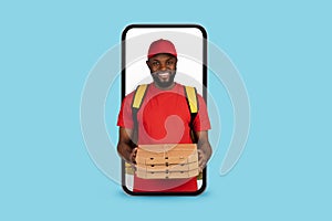 Food Delivery App. Black Courier Guy With Pizza Looking Out Of Smartphone