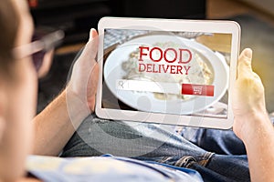 Food delivery app on tablet.