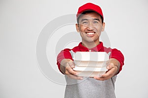 Food delivery man holding food box isolated on white background.