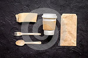 Food delivery with paper bags and plastic cup on dark table background top view mockup