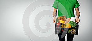 food delivery service - man with groceries box in hands