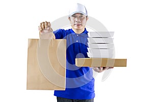 Food delivery service or order food online. Delivery man in blue uniform hand holding food packaging container and paper bag