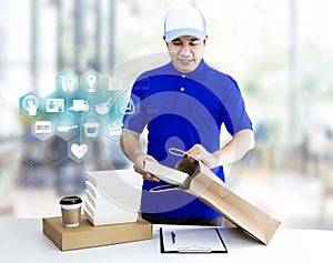 Food delivery service for order online shopping concept and icon media symbol. Delivery man in blue uniform hand holding paper bag