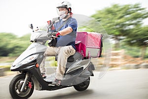 Food delivery staff ride motorcycles to deliver food