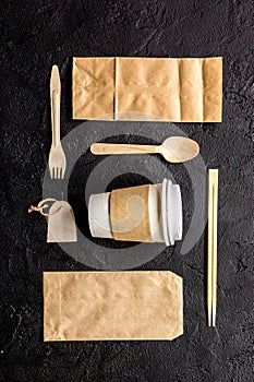 Food delivery workdesk with paper bags and plastic cup table background top view mock-up