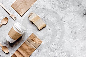 food delivery workdesk with paper bags and plastic cup table background top view mock-up