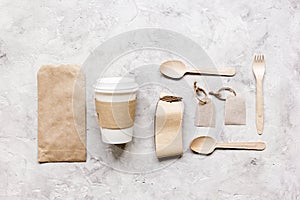 Food delivery workdesk with paper bags and plastic cup table background top view mock-up