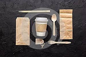 Food delivery workdesk with paper bags and plastic cup table background top view mock-up