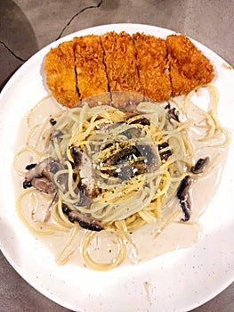 food delliciose good spageti carbonara with chicken katsu photo
