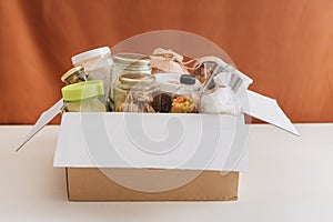 Food donations box isolated on table