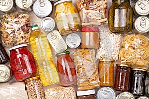 Food donations such as pasta, rice, oil, peanut butter, canned food, jam and other on a table