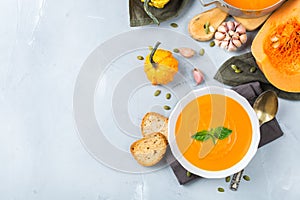 Fall autumn roasted orange pumpkin carrot soup with garlic