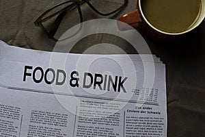 Food and Drink text in headline  on brown background. Newspaper concept