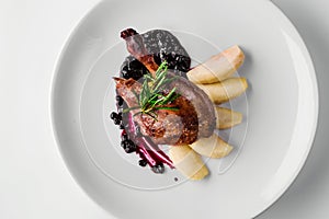 Food. Duck leg with pear and currant sauce. Delicatessen Gourmet Restaurant Menu Concept