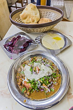 Food in Egypt - fuul (stew of cooked fava beans), hummus, beetroot and bre