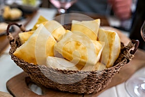 Food of Emilia Romagna region, deep fried bread gnocco fritto or crescentina served in restaurant in Parma, Italy