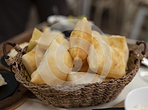 Food of Emilia Romagna region, deep fried bread gnocco fritto or crescentina served in restaurant in Parma, Italy photo