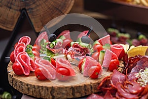 Food at event. Assorted Canape on Rustic Wooden Platter