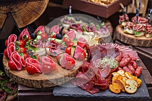 Food at event. Assorted Canape on Rustic Wooden Platter