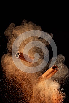 Food explosion with cinnamon sticks and powder