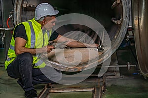 Food factory engineer checking steam retort get ready to use