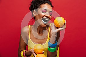 Food fashion photo of joyful mixed-race woman with colorful make