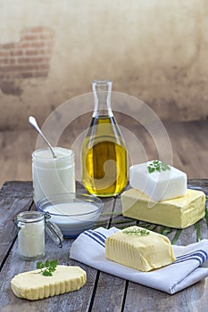 Food Fats and oil : set of dairy product and oil and animal fats on a wooden background