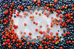 Food frame with mix of strawberry, blueberry. Top view. Vegan and vegetarian concept. Summer berries background