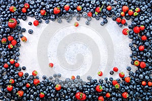 Food frame with mix of strawberry, blueberry. Top view. Vegan and vegetarian concept. Summer berries background