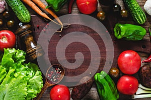 Food frame: summer vegetables on wooden cutting board