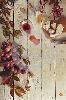 Food frame with wine, grapes and cheese