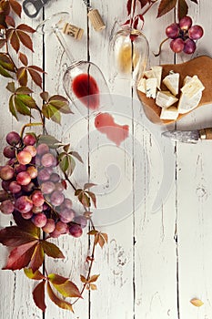 Food frame with wine, grapes and cheese