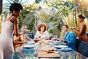 Food, friends and happy people outdoor at a table for social gathering, happiness and holiday celebration. Diversity