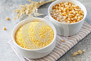Food gluten free ingredient. Corn groats and seeds over gray stone background