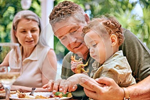 Food, grandpa and baby on lap eating vegetables for healthy, diet and nutrition in family home. Help, health and elderly